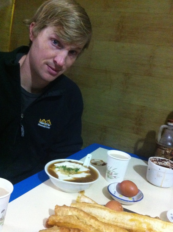 Traditional breakfast... tofu soup, tea soaked egg, and oil sticks (also a soy bean milk - not pictured - that you can dip the oil stick in).