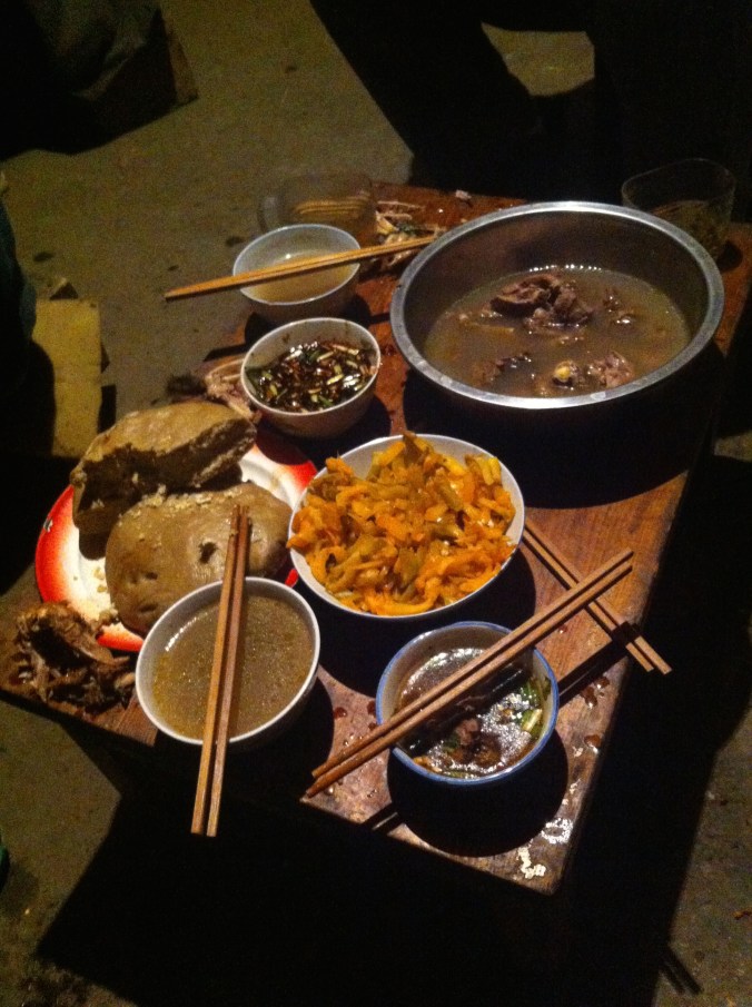 boiled chicken top right, pickled veggies in the center, and the barley bread bottom left.